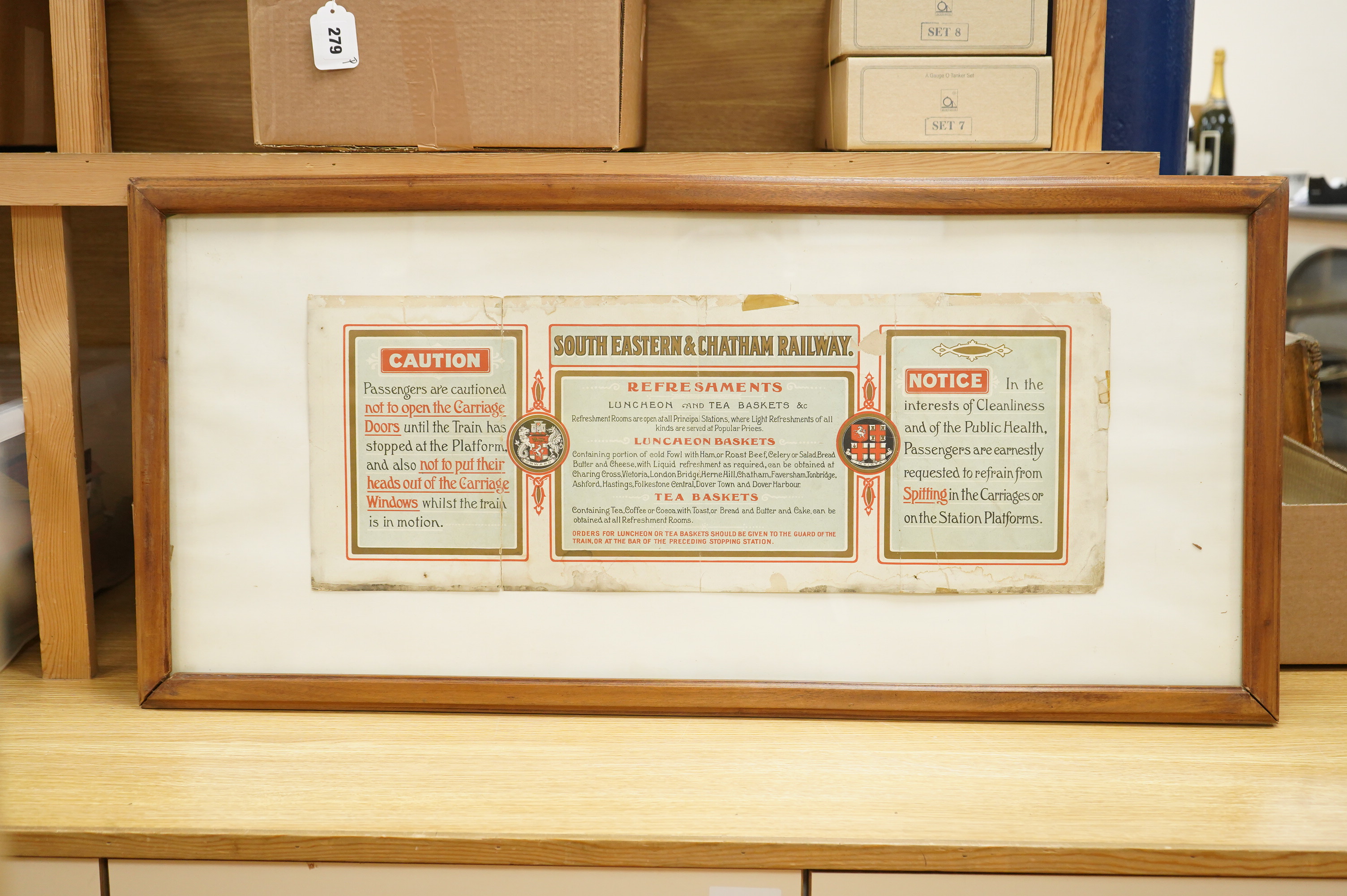 An original early 20th century SECR ‘carriage print’ advertising poster divided into three sections under the title South Eastern & Chatham Railway, including a buffet menu, a notice regarding spitting and a caution note